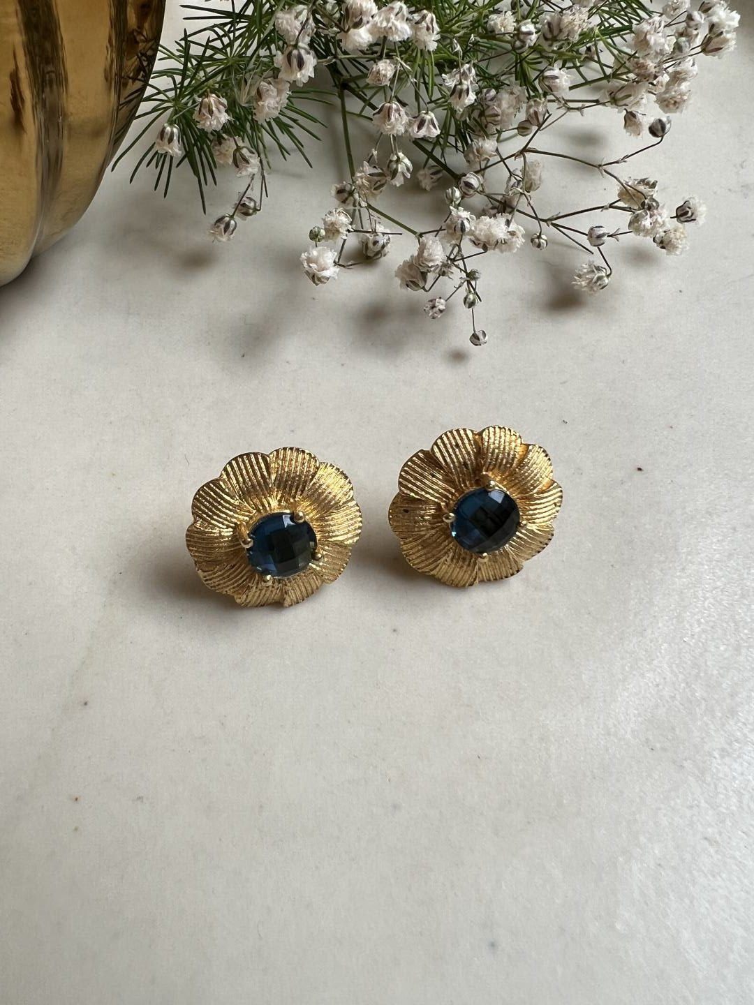 GOLD TONED BLUE FLORAL SHAPED STUD EARRING jewellery in 24K gold plating | XAGO Luxe