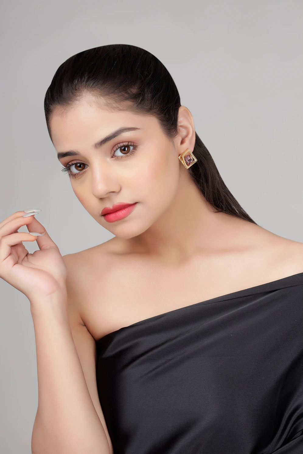 Side view of Amethyst Prism stud earrings worn by model