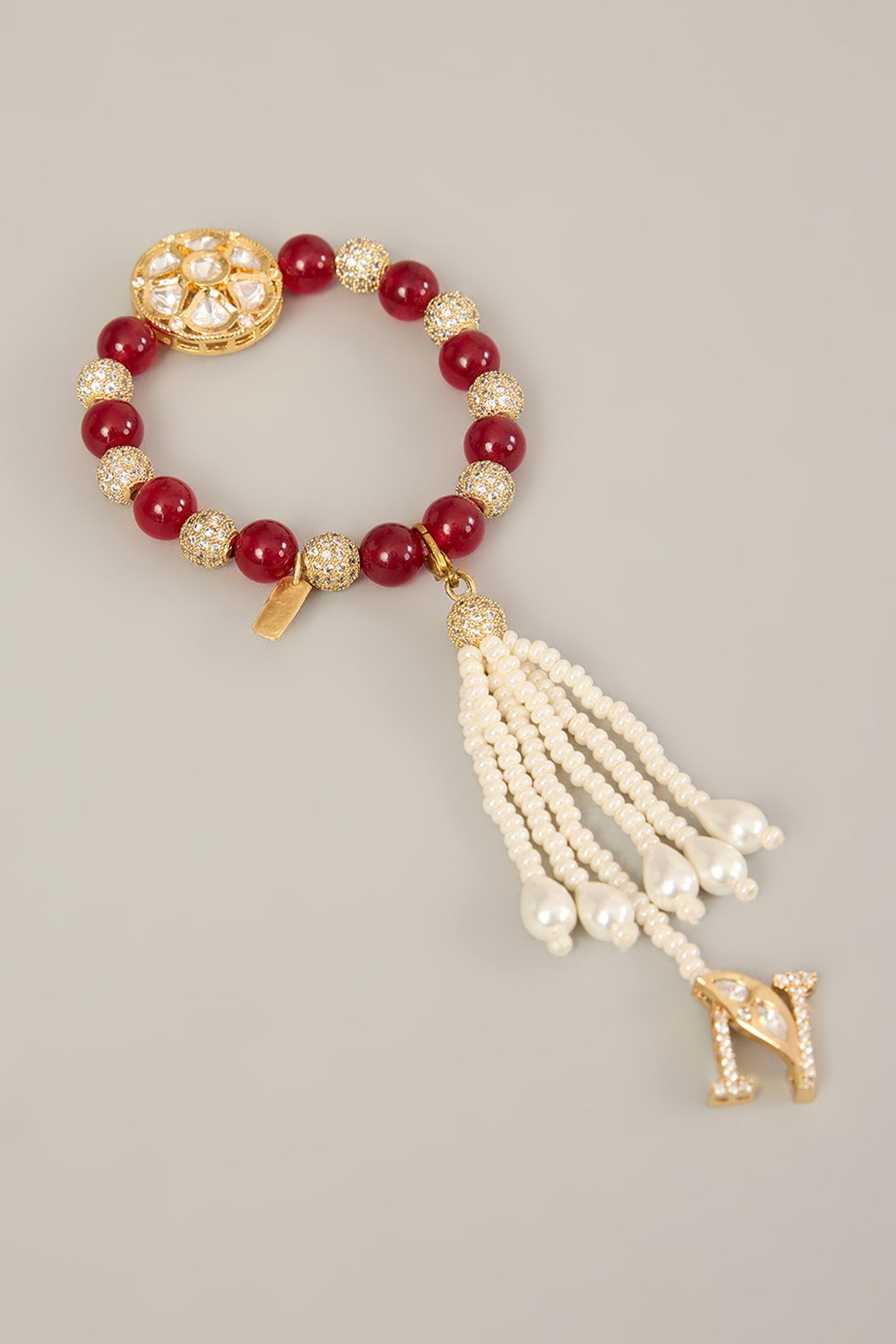 Ruhani Lumba – Polki Motif Lumba with Red Beads & Pearl Hangings | Rakhi for Bhabhi by XAGO designer jewellery in 24K gold plating | XAGO Luxe