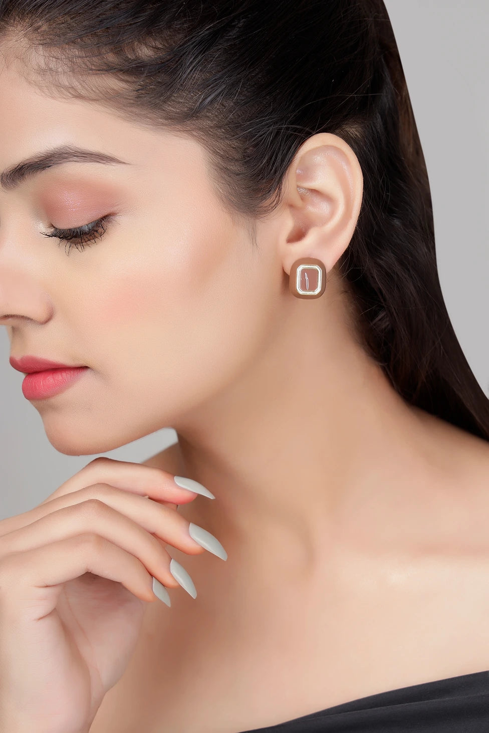 Café enamel stud earrings in brown with gold finish on model