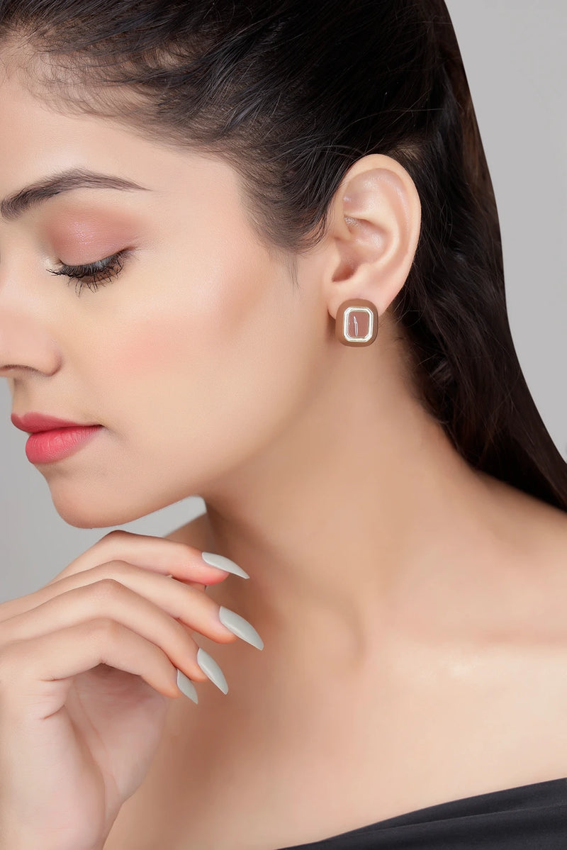 Café enamel stud earrings in brown with gold finish on model