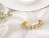 DANA BLUE QUARTZ HANDCUFF jewellery in 24K gold plating | XAGO Luxe