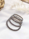 LE ANOMA SET OF 4 SILVER PLATED OXIDIZED BANGLES jewellery in 24K gold plating | XAGO Luxe