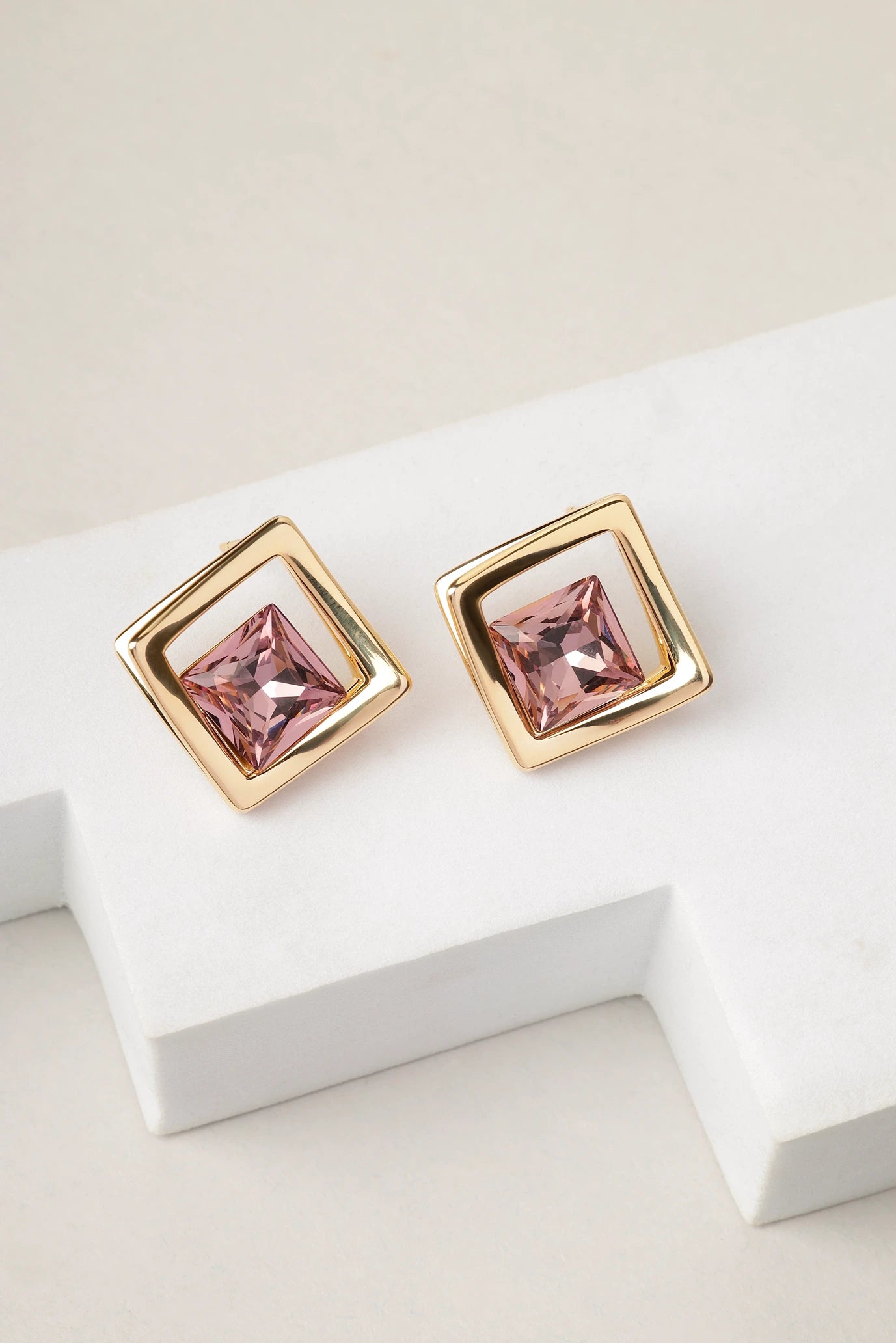 Amethyst Prism stud earrings displayed on white surface