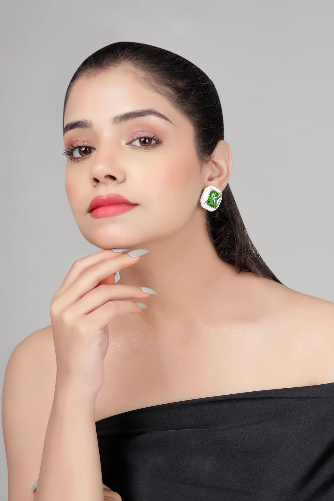 Model wearing Emerald Frost green crystal cushion stud earrings