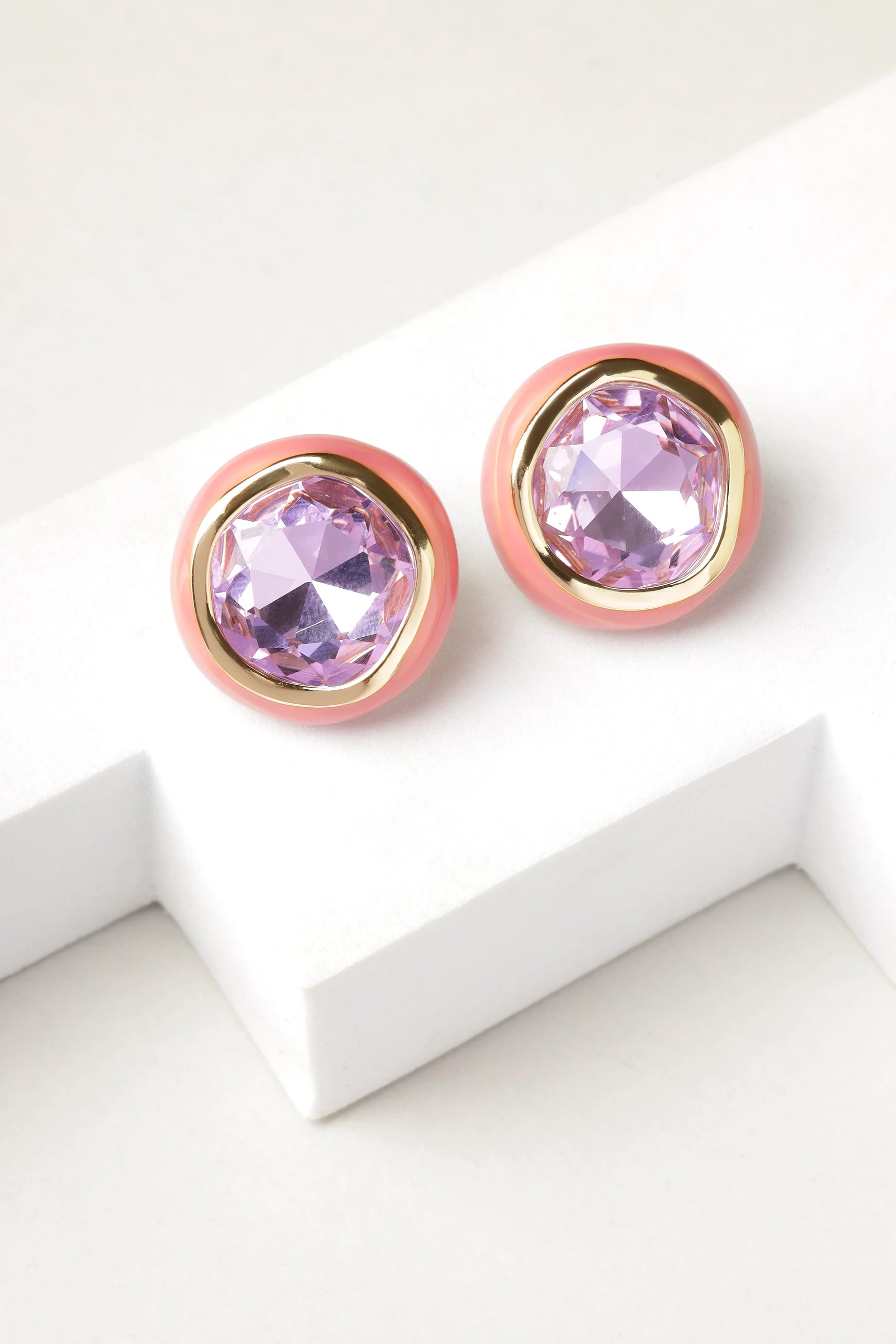 Rosé Amethyst stud earrings displayed on white surface