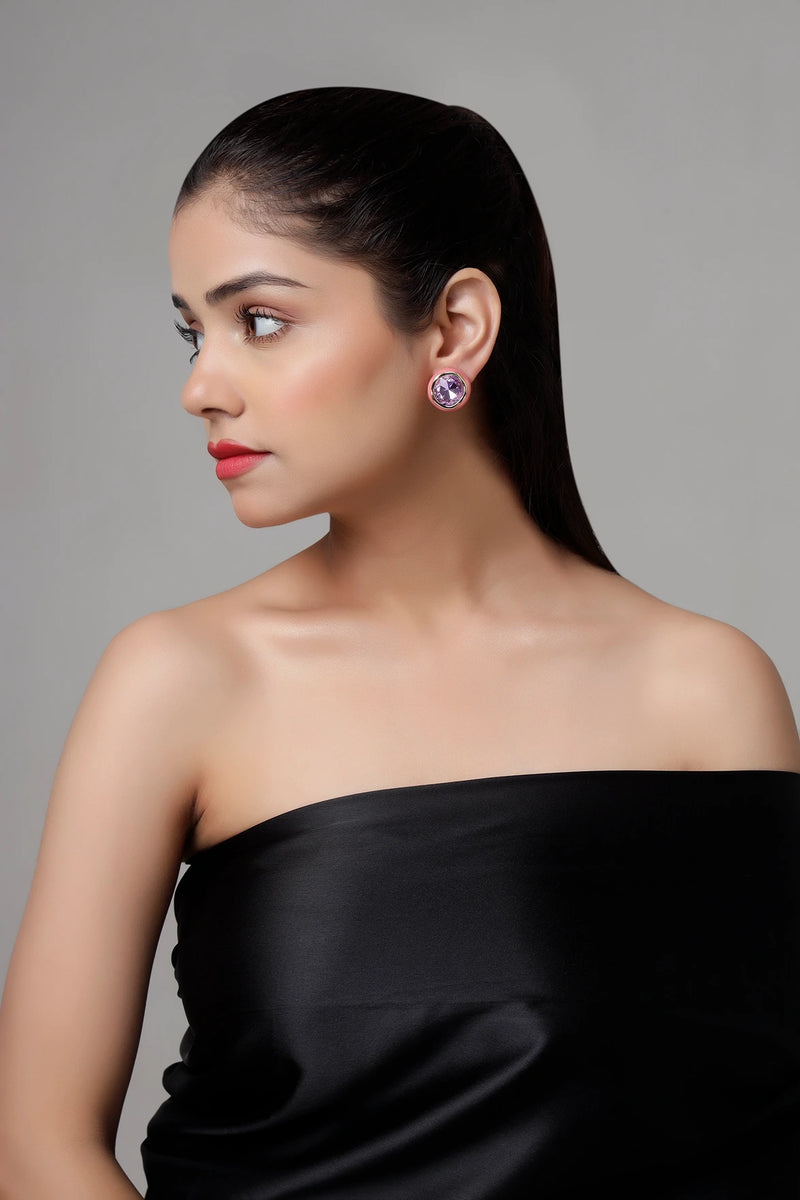 Rosé Amethyst stud earrings worn by model with pink enamel and gold finish