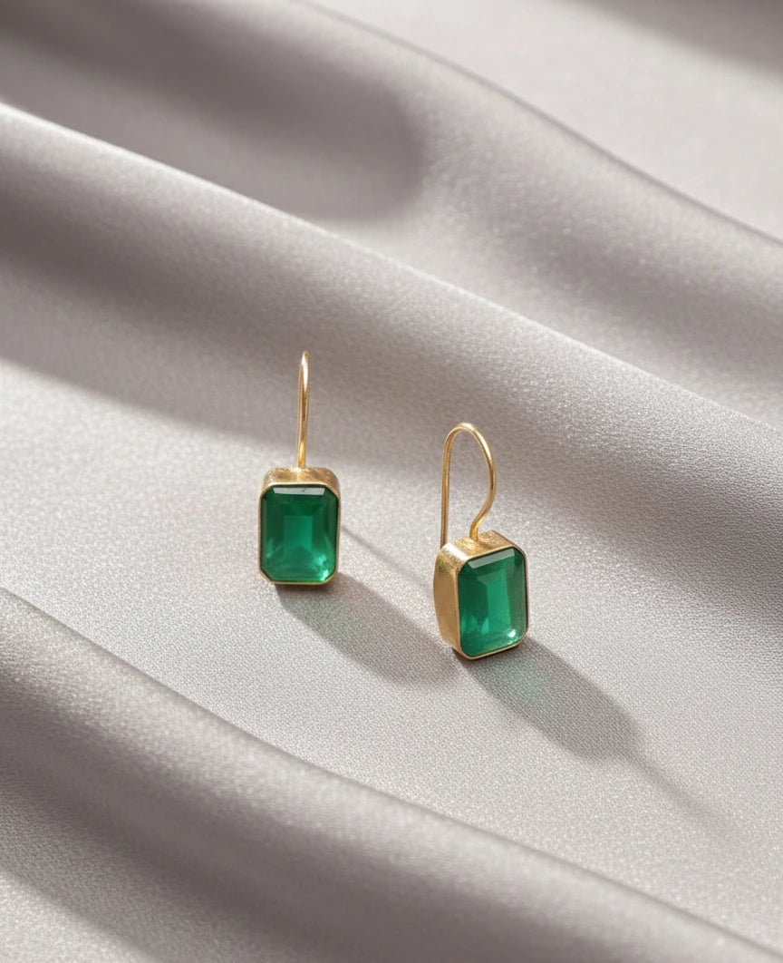 Minimal green onyx drop earrings in gold finish flatlay