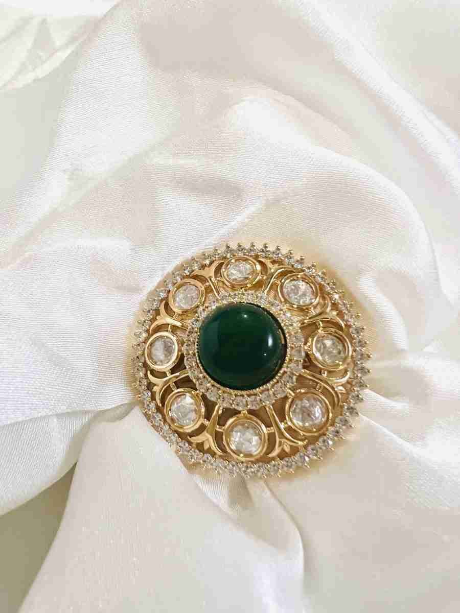 "Elegant Polki Ring Studded with American Diamond and Emerald Green"